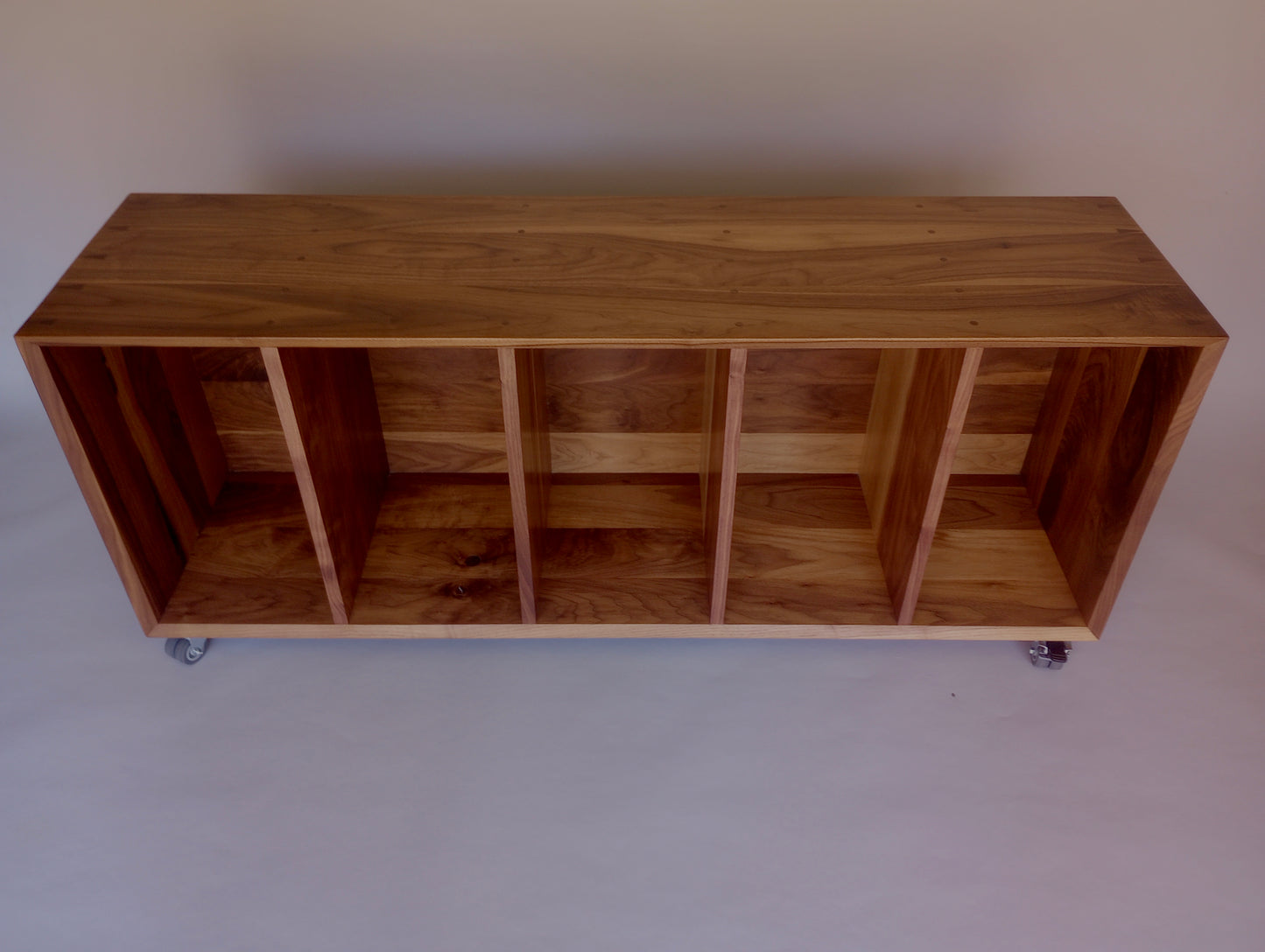 Walnut basket storage console on wheels